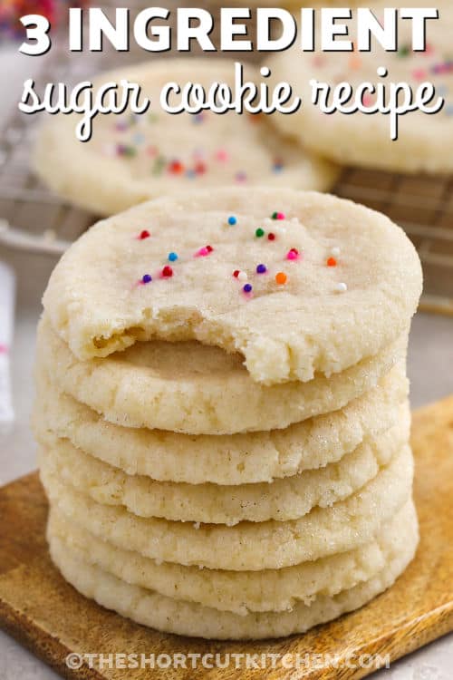 stack of 3 Ingredient Sugar Cookie Recipe with a bite taken out of one with writing