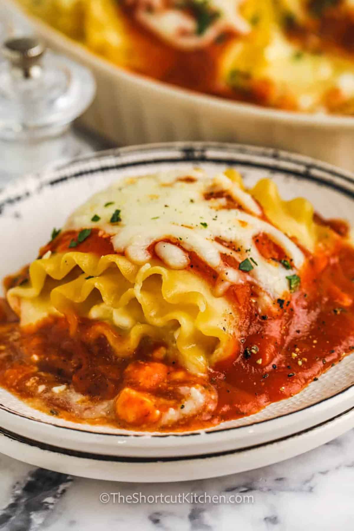 close up of plated Three Cheese Lasagna Rolls