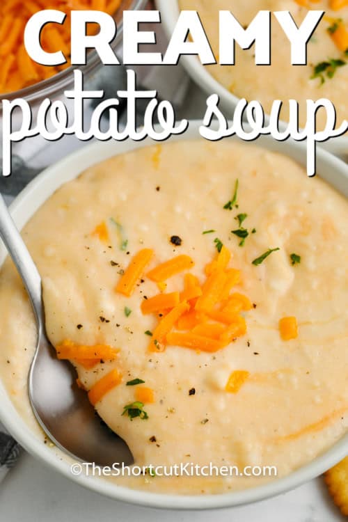Creamy Potato Soup in a bowl with a spoon and writing