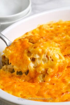 Sour Cream Macaroni and Cheese in a casserole dish with a serving spoon