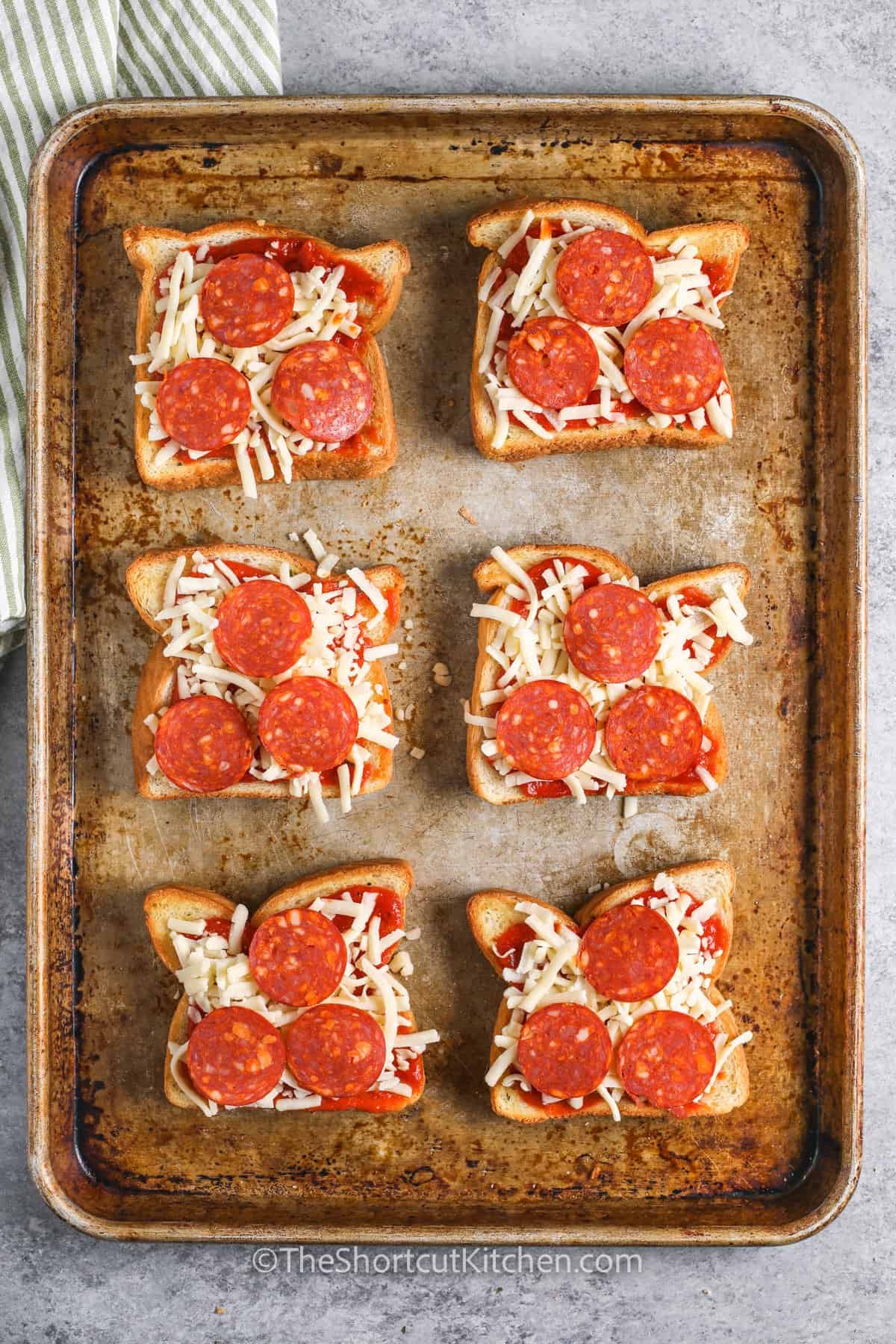 adding pepperoni to Texas toast to make Texas Toast Pizza