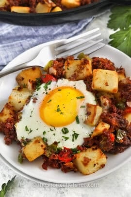 plated Canned Corn Beef Hash with a fork