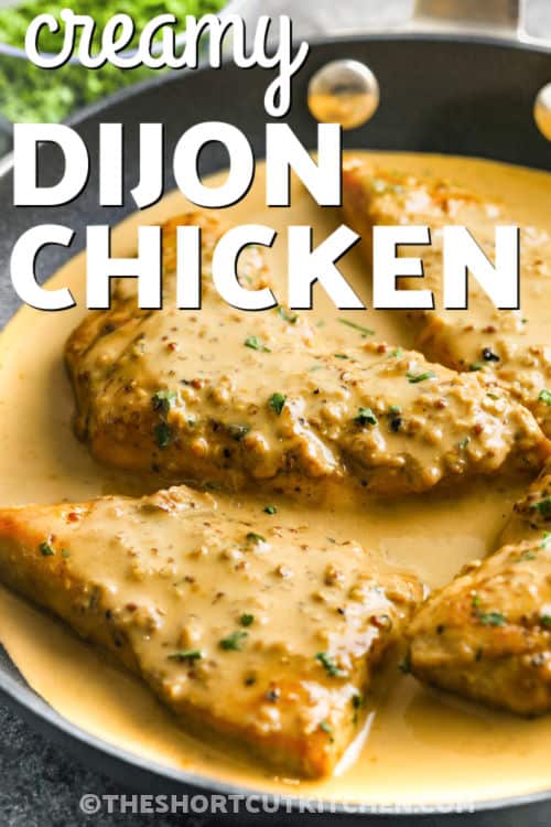 Creamy dijon chicken is a flavorful dish that is elegant enough for company, yet simple enough for a quick and easy weeknight family dinner. Tender chicken breasts are pounded to an even thickness, then seared and simmered in a rich and creamy white wine sauce flavored with soy and Dijon mustard. Serve over rice or noodles for a hearty and satisfying dish. Everything comes together in one easy skillet, making cleanup a breeze! #theshortcutkitchen pan of Creamy Dijon Chicken with writing
