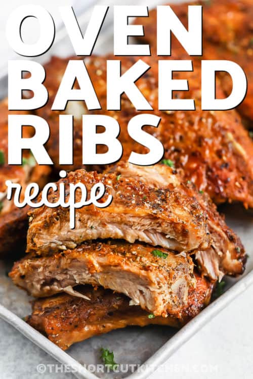 juicy Oven Baked Ribs Recipe on a pan with writing
