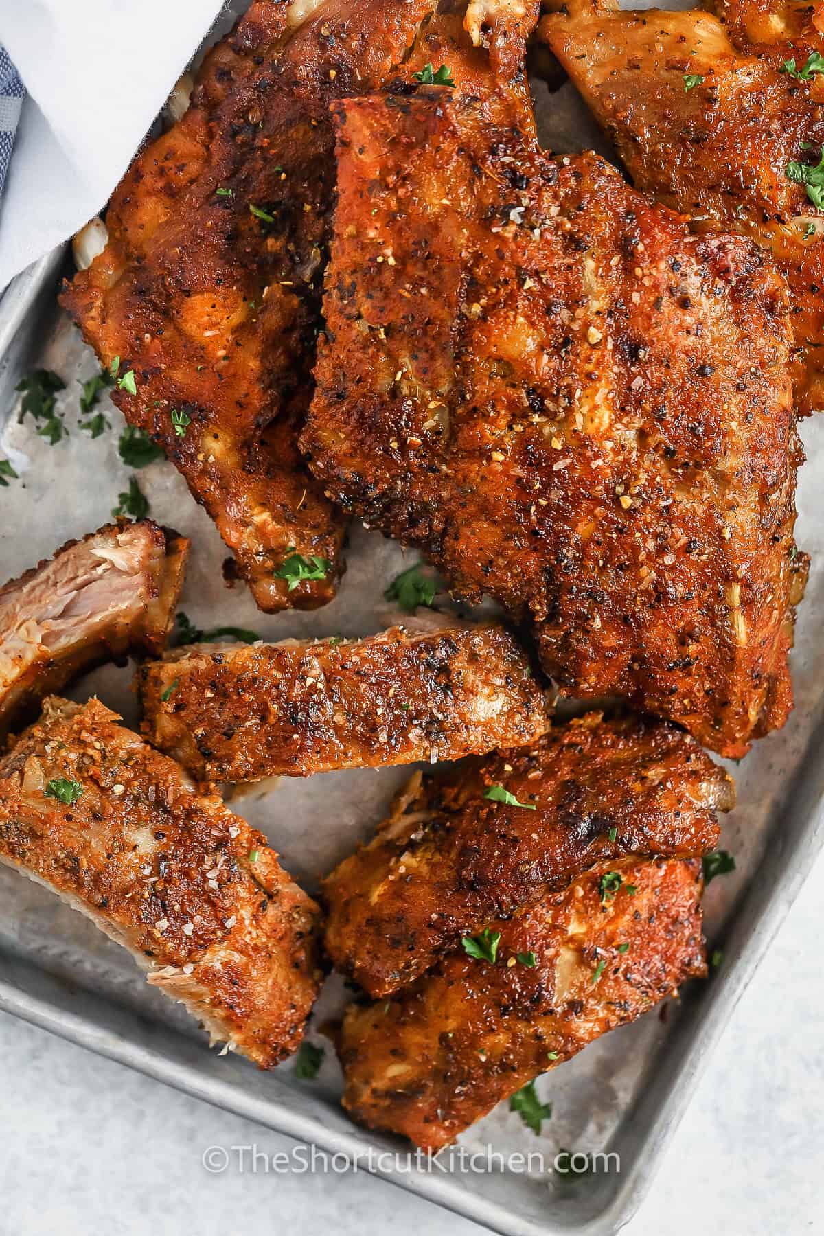 Oven Baked Ribs Recipe with one cut into slices