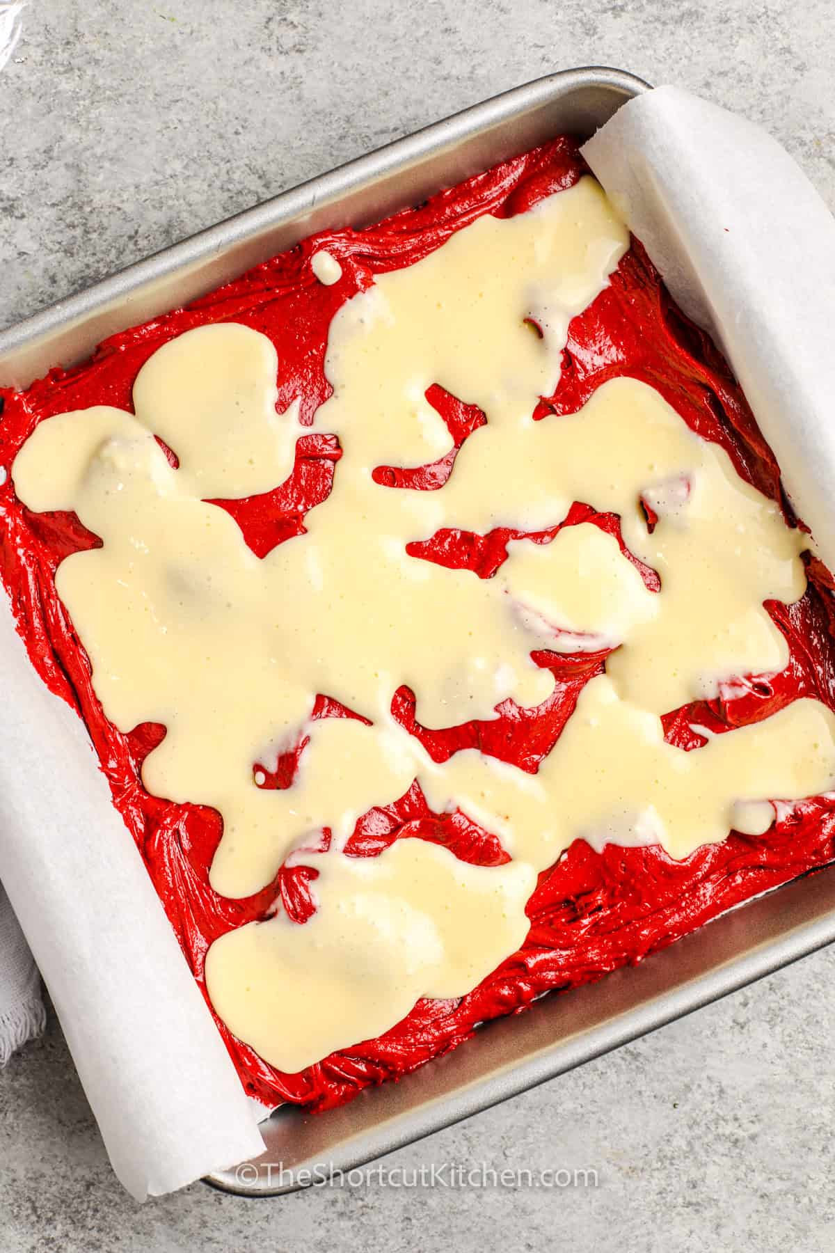 red velvet brownie batter topped with cream cheese mixture