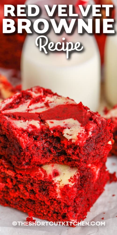 two red velvet brownies one with a bite removed with writing