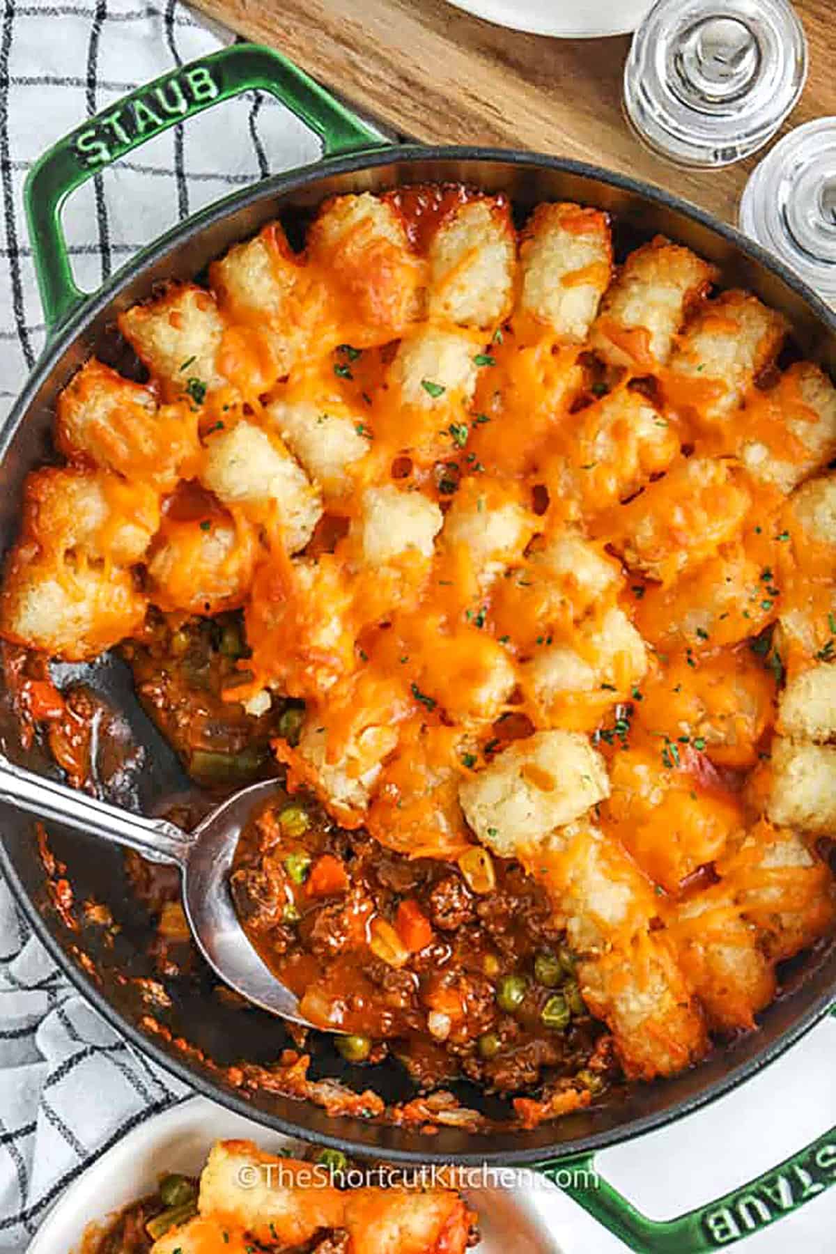 top view of shepherd's pie in a pot with a spoon