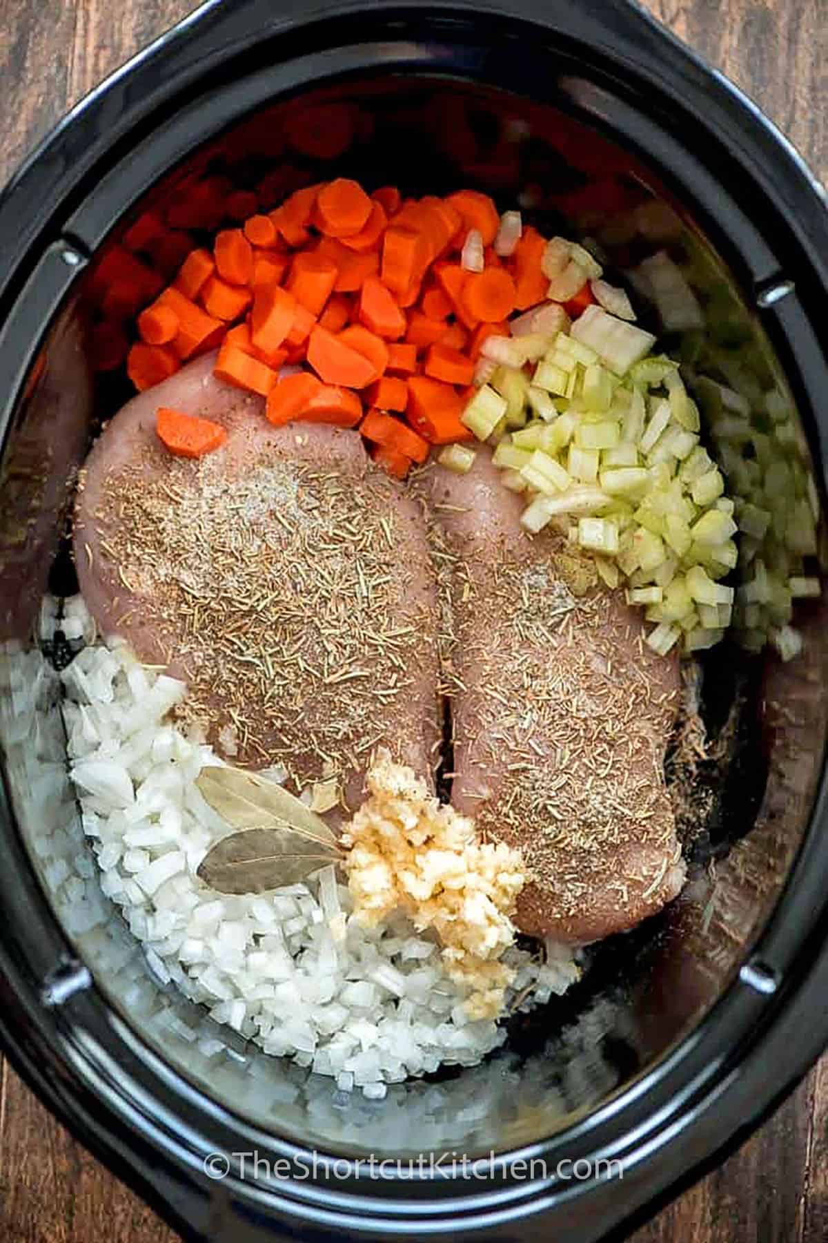 ingredients in slow cooker to make Slow Cooker Chicken Wild Rice Soup