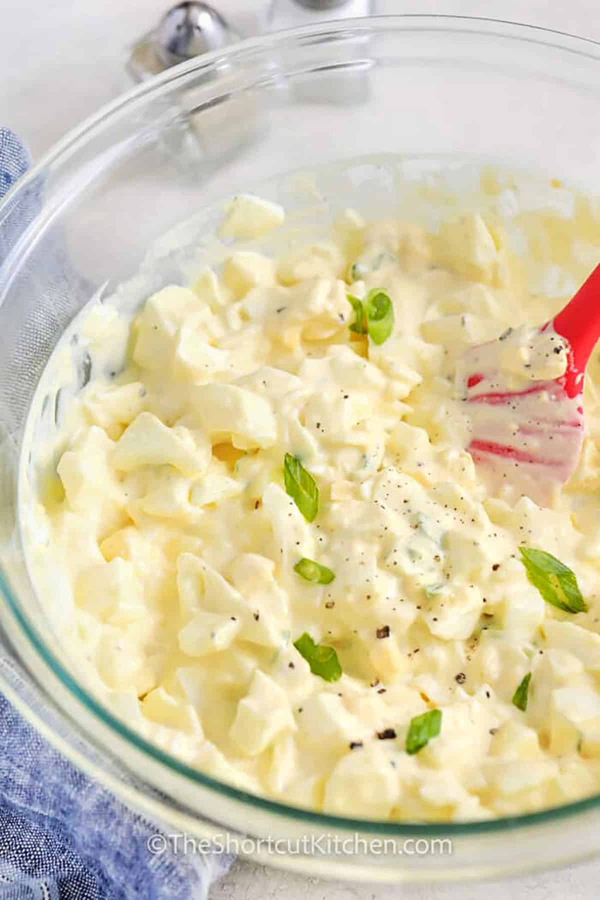 close up of mixed Best Egg Salad Recipe in a bowl