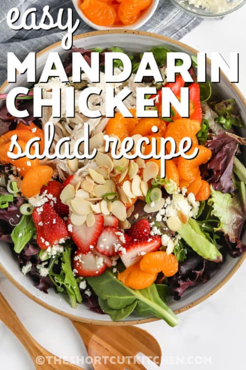 Easy Mandarin Chicken Salad Recipe in a bowl with strawberries and a title