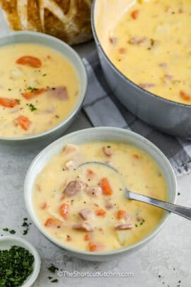 cheesy ham and potato soup in a bowl