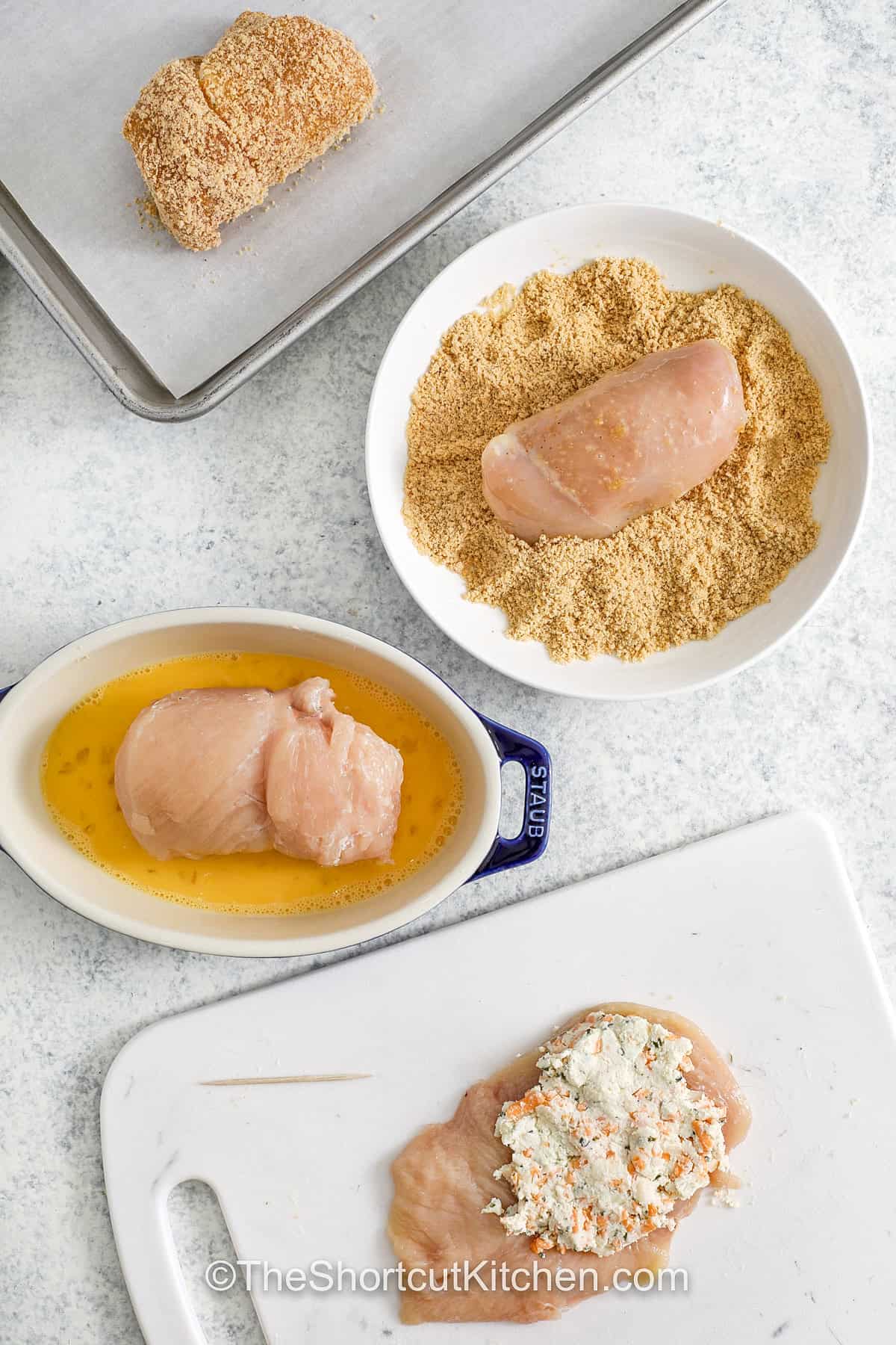 stuffing and coating stuffed chicken in egg wash and breadcrumbs to make Chicken Rolls