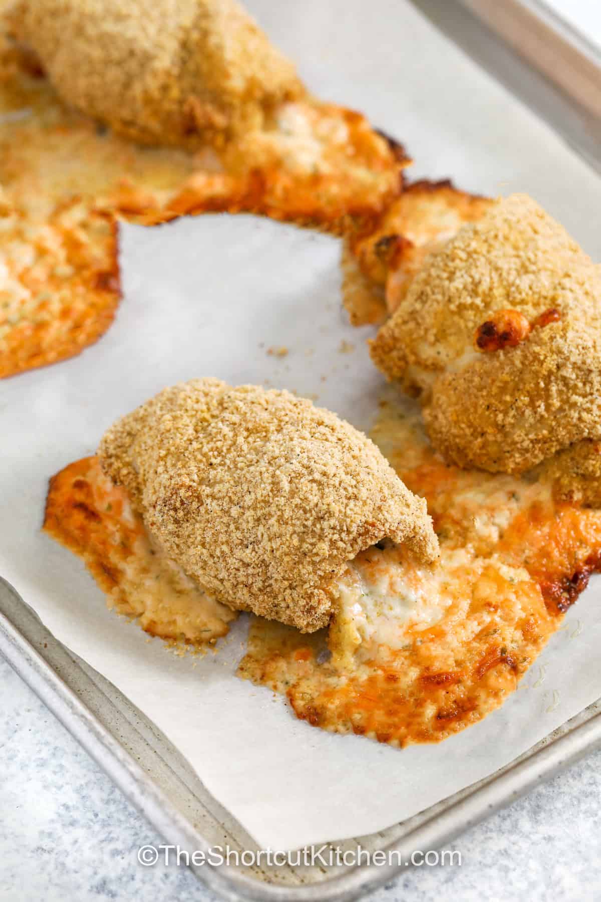 cheesy stuffed Chicken Rolls on a sheet pan