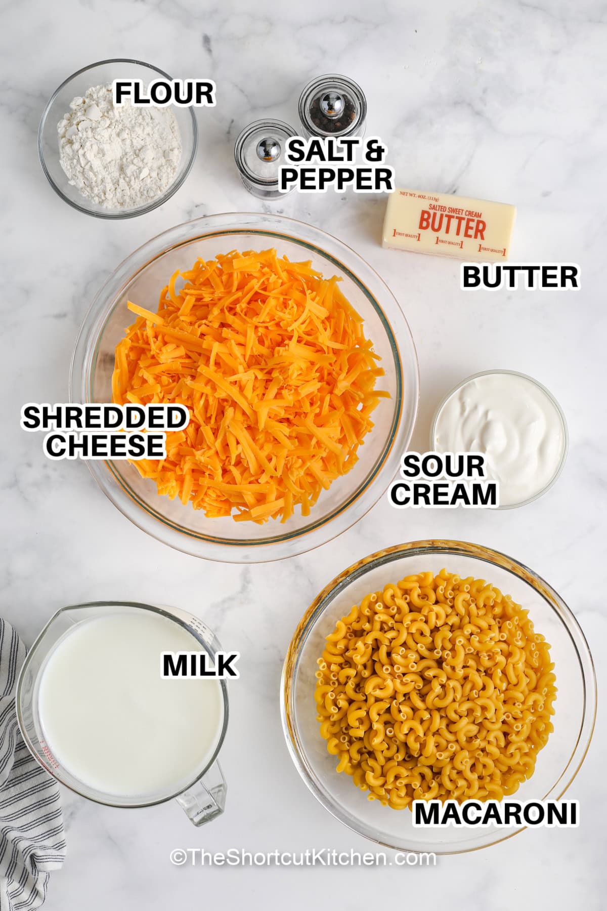 This quick and easy macaroni and cheese with sour cream is a creamy, cheesy comfort food everyone will love. Made with milk, cheddar, and sour cream, the sauce is rich and smooth, while the dish is baked to golden, bubbly perfection in the oven. The recipe is simple and quick, making it the best choice for a delicious and hearty meal any time. Serve it up for a satisfying dinner the whole family will enjoy! #theshortcutkitchen