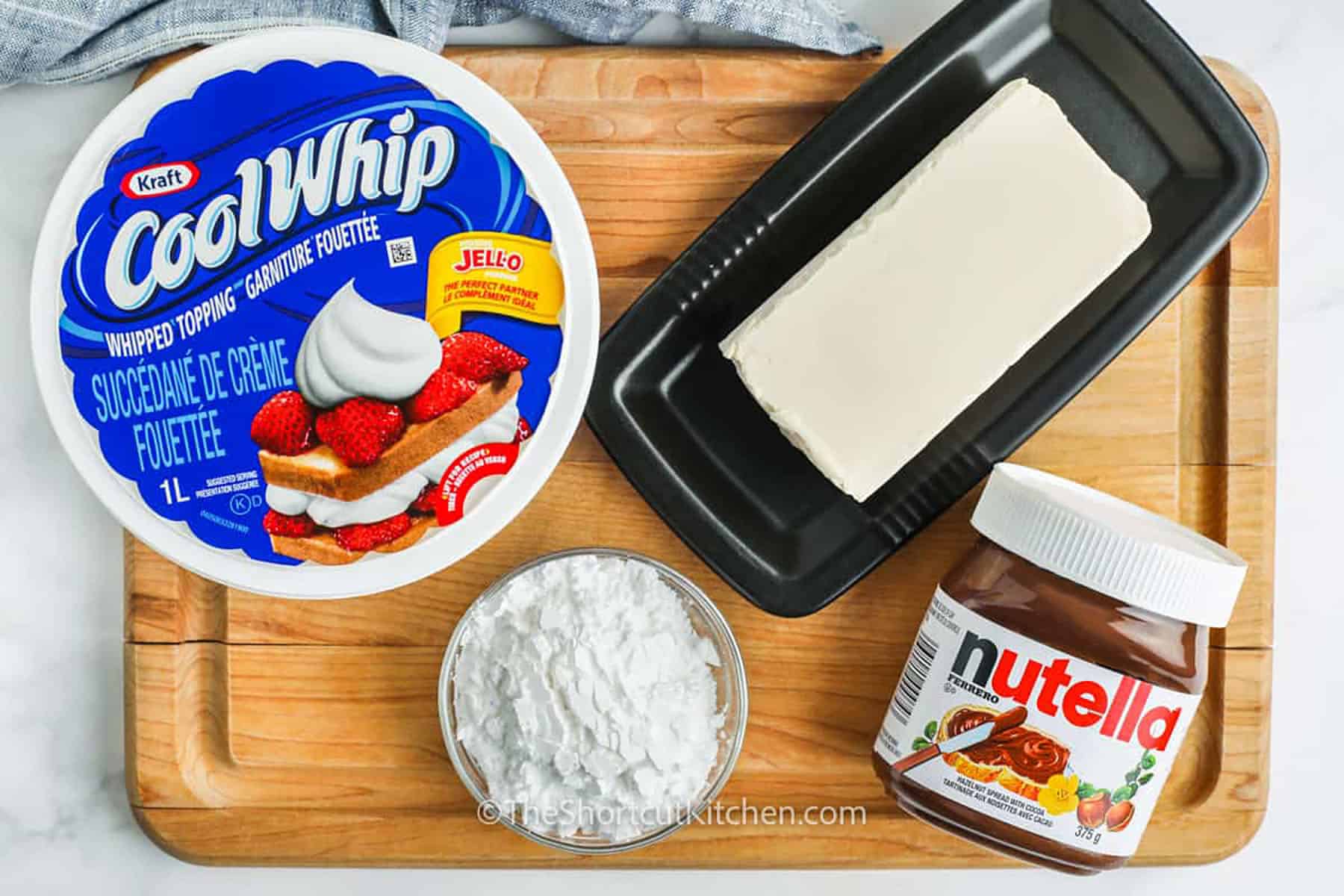 Nutella Dip ingredients on a cutting board