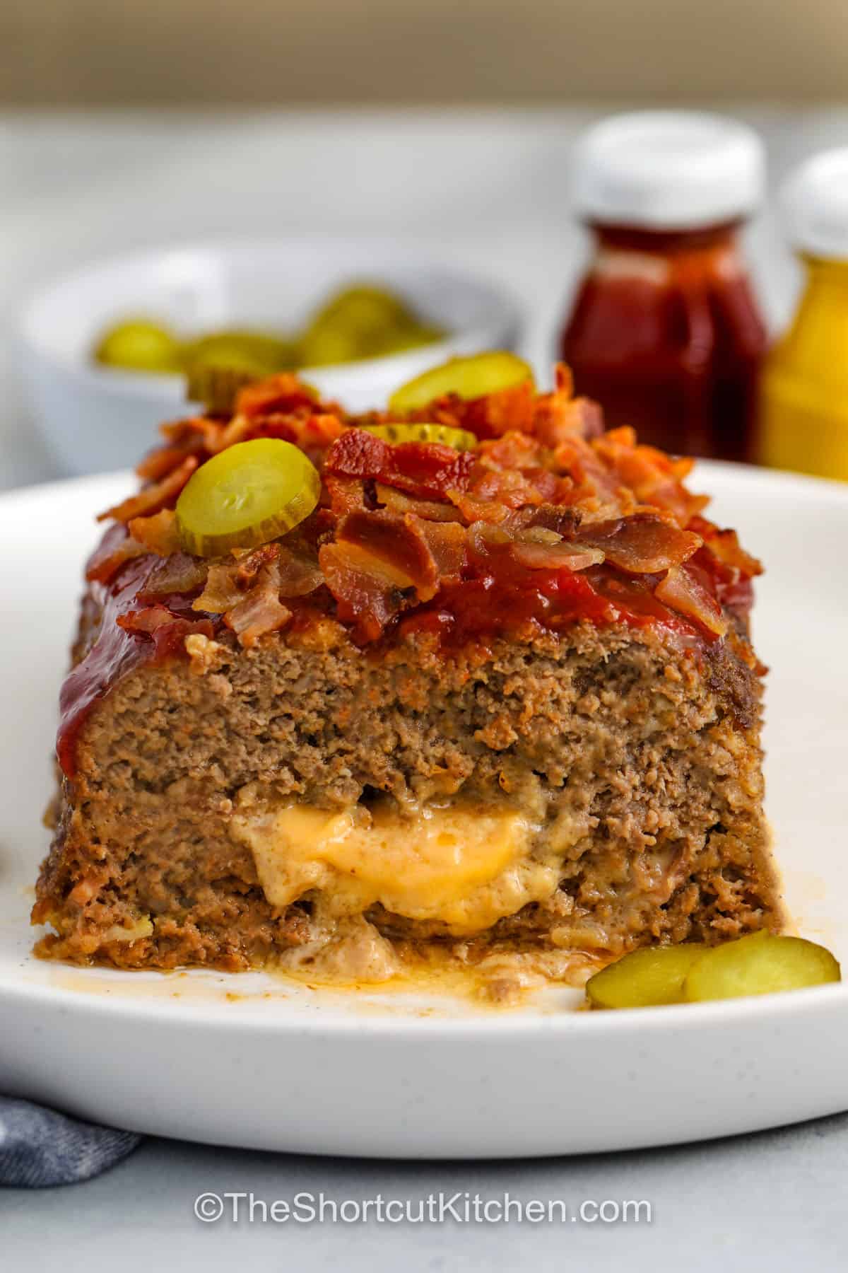 Bacon Cheeseburger Meatloaf with pickles on top
