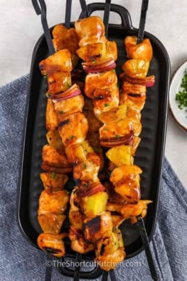 chicken pineapple kabobs on a serving dish