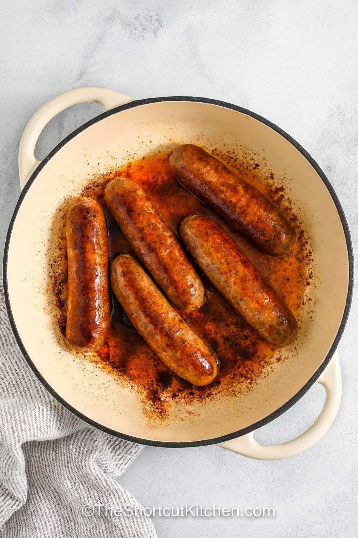 cooked sausage in a pan to make Italian Sausage Spaghetti