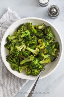 plated Roasted Frozen Broccoli with a spoon