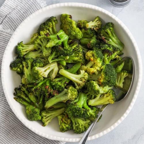 plated Roasted Frozen Broccoli with a spoon