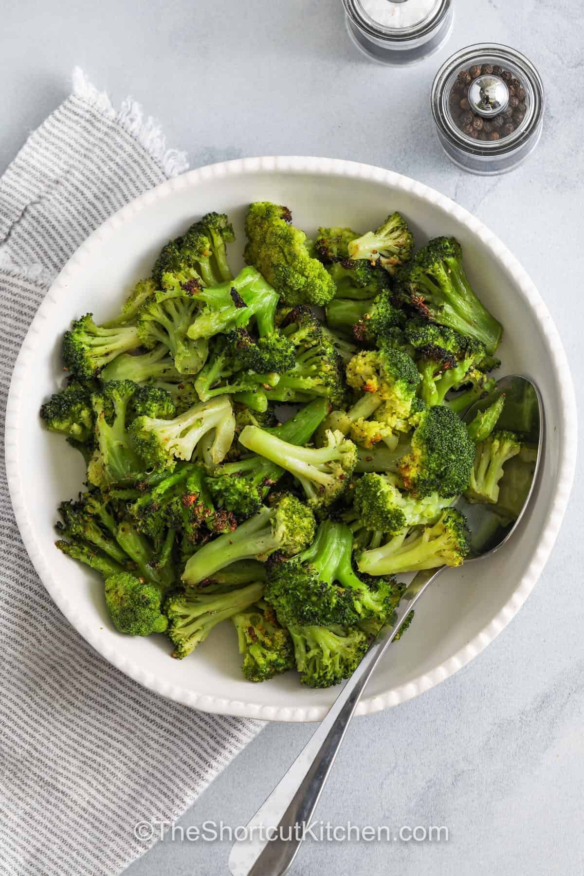 plated Roasted Frozen Broccoli with a spoon