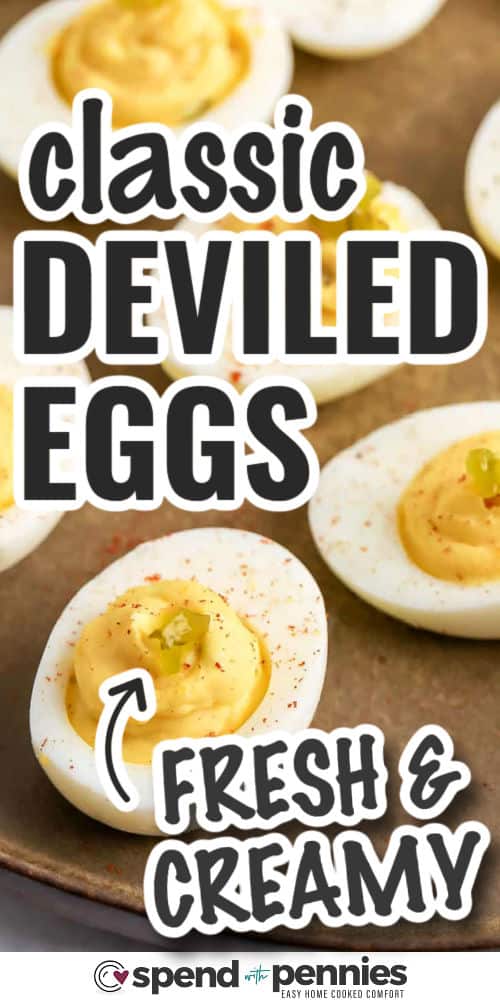fresh and creamy Classic Deviled Eggs on a plate with writing