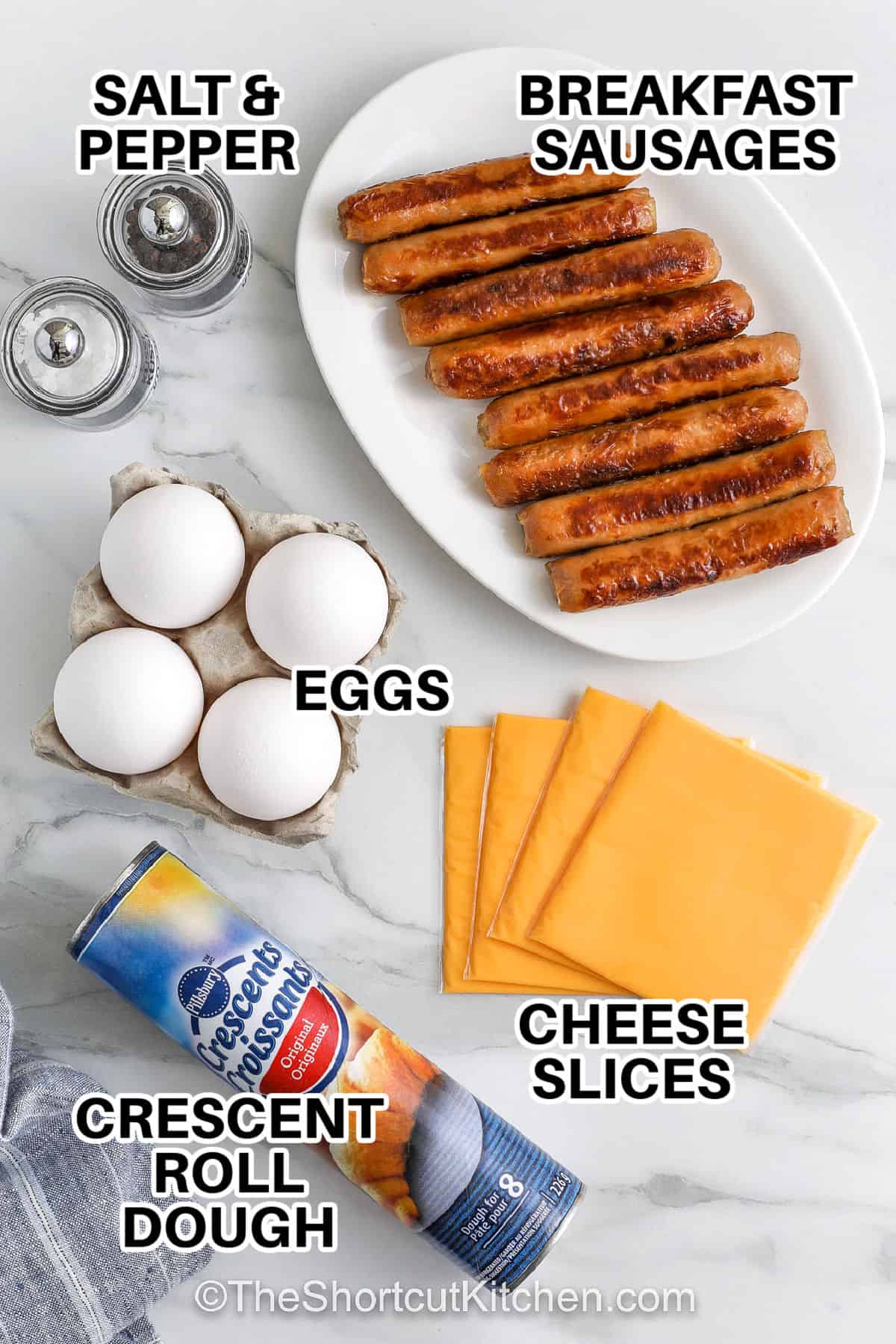 breakfast sausages, eggs, cheese slices, crescent roll dough, salt & pepper to make Crescent Roll Breakfast.