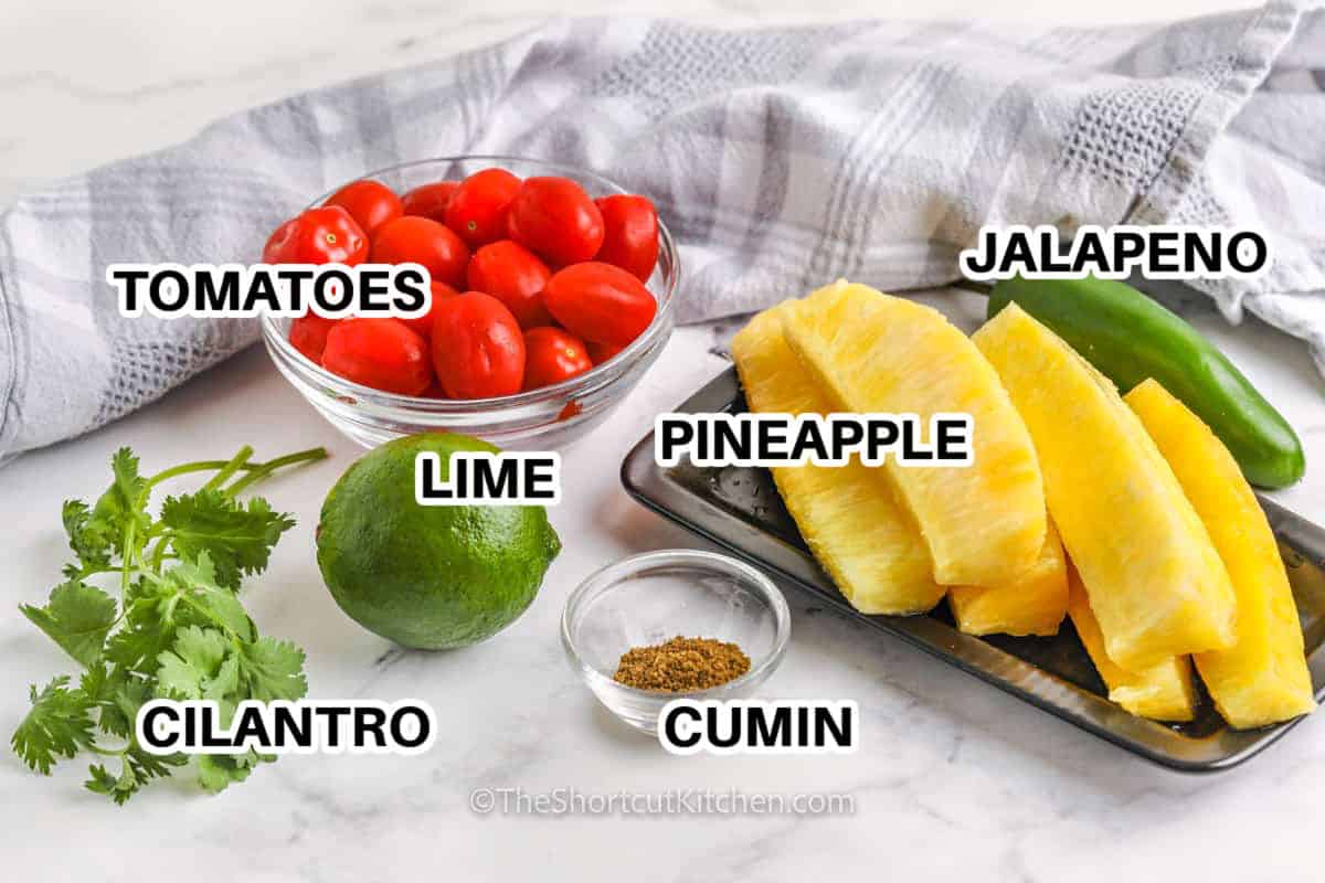 tomatoes , lime , cilantro , cumin , pineapple , jalapeno with labels to make Pineapple Jalapeno Salsa