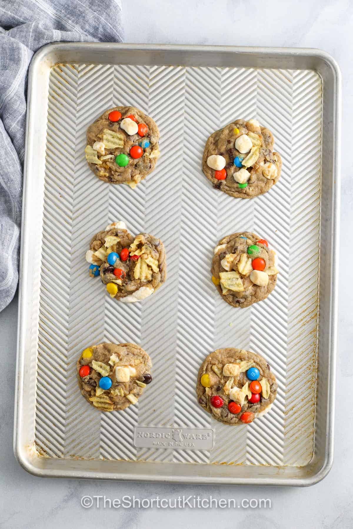 baked Kitchen Sink Cookies on a sheet pan