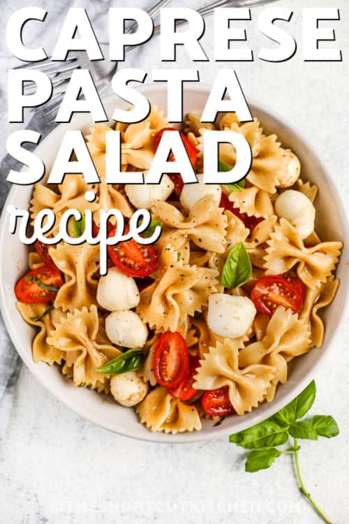 plated Caprese Pasta Salad with dressing and writing