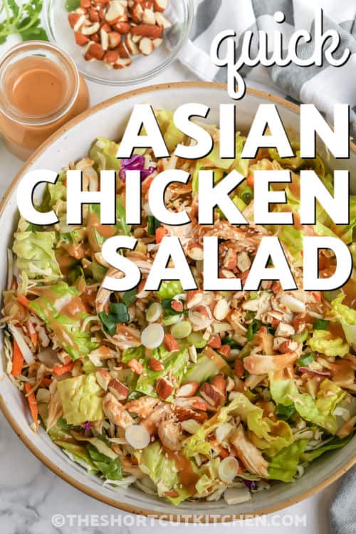 Quick Asian Chicken Salad in a bowl with dressing and writing