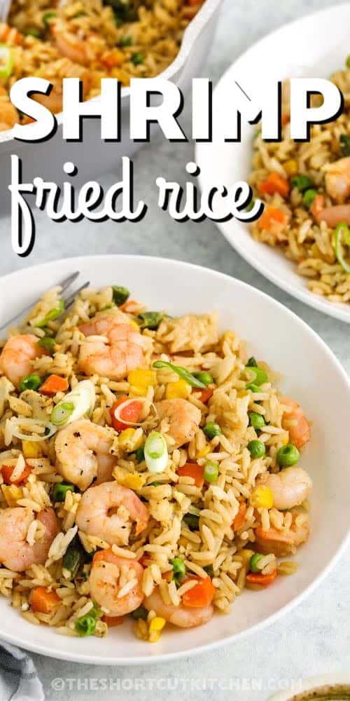 Shrimp Fried Rice in bowls with pan full in the back and a title