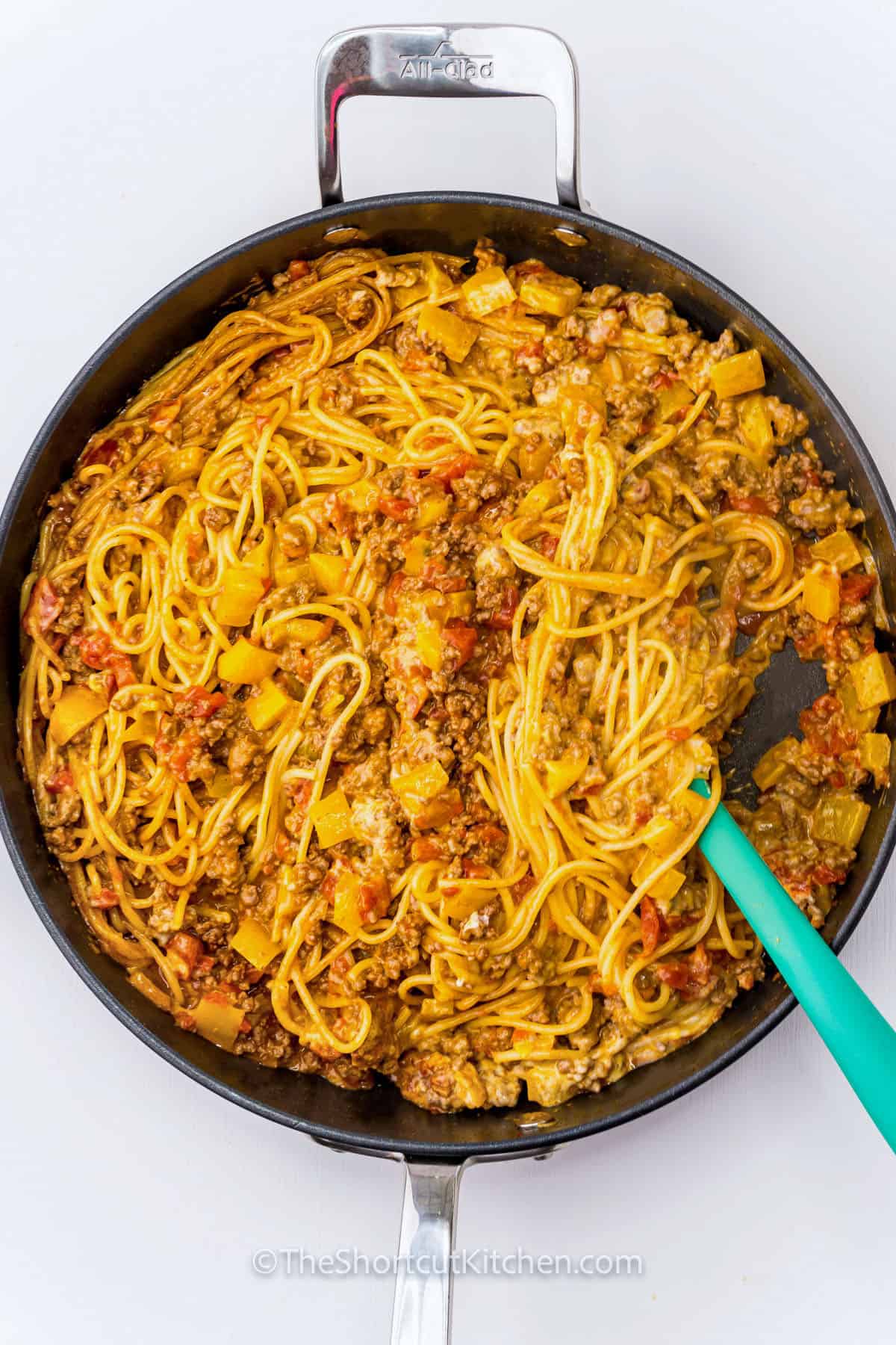 mixing Taco Spaghetti Recipe in pan