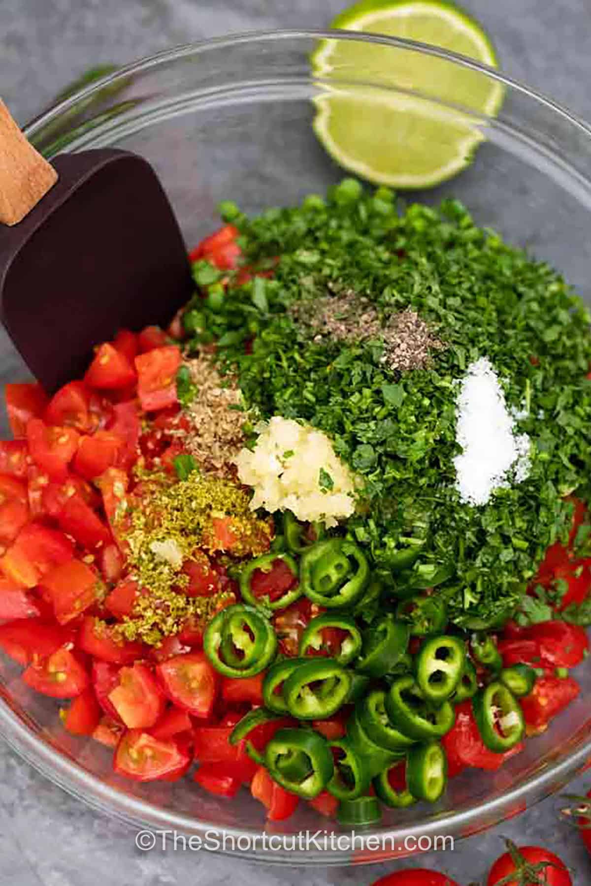 adding ingredients to bowl to make Best Homemade Salsa Recipe