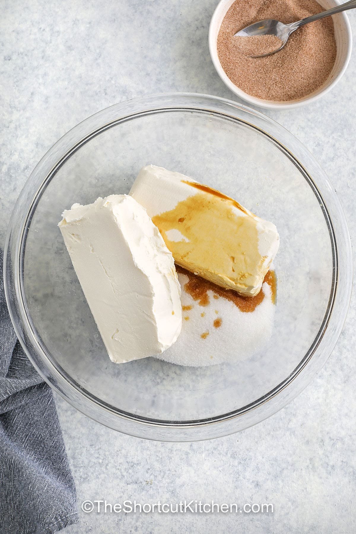 adding cream cheese and vanilla to sugar to make Cream Cheese Squares