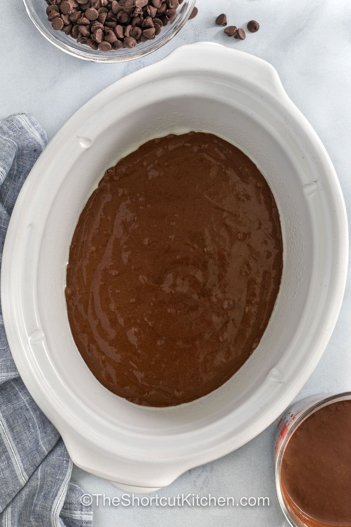 adding Crockpot Lava Cake batter to the crock pot