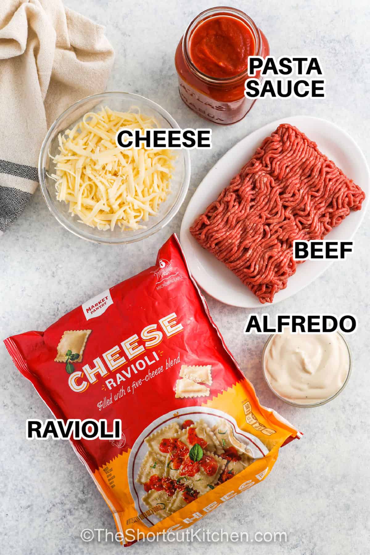 cheese , pasta sauce , beef , alfredo , ravioli with labels to make Frozen Ravioli Bake