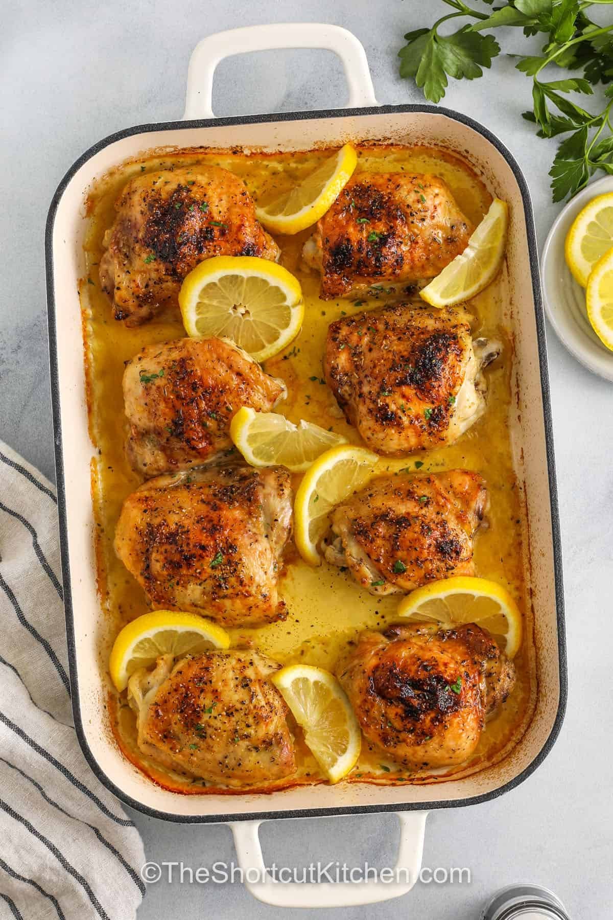 cooked Lemon Pepper Chicken Thighs in a dish