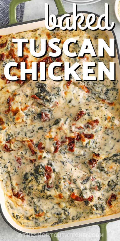 cheesy Baked Tuscan Chicken in a casserole dish with writing