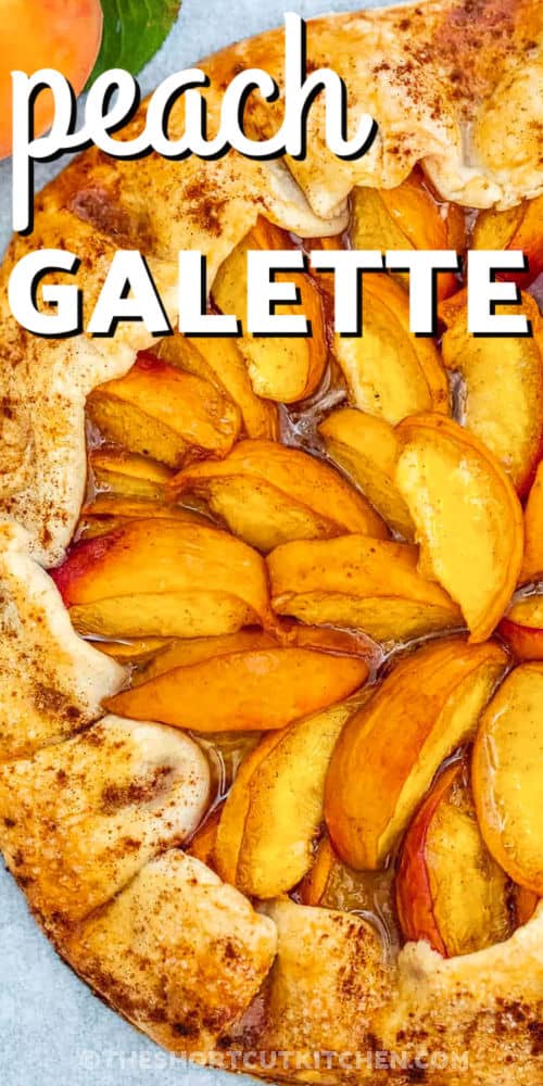 This easy peach galette recipe brings all the cozy charm of a rustic bakery treat right to your kitchen. With a buttery crust that bakes golden and crisp, and fresh peaches layered in sweet cinnamon and nutmeg, it’s a summer dessert you’ll want to make again and again. It has all the flavors of a classic tart but with a simple, open-face style that’s just so pretty on the table. Serve it warm or at room temperature with a dollop of whipped cream. #theshortcutkitchen close up of sweet Peach Galette Recipe with a title