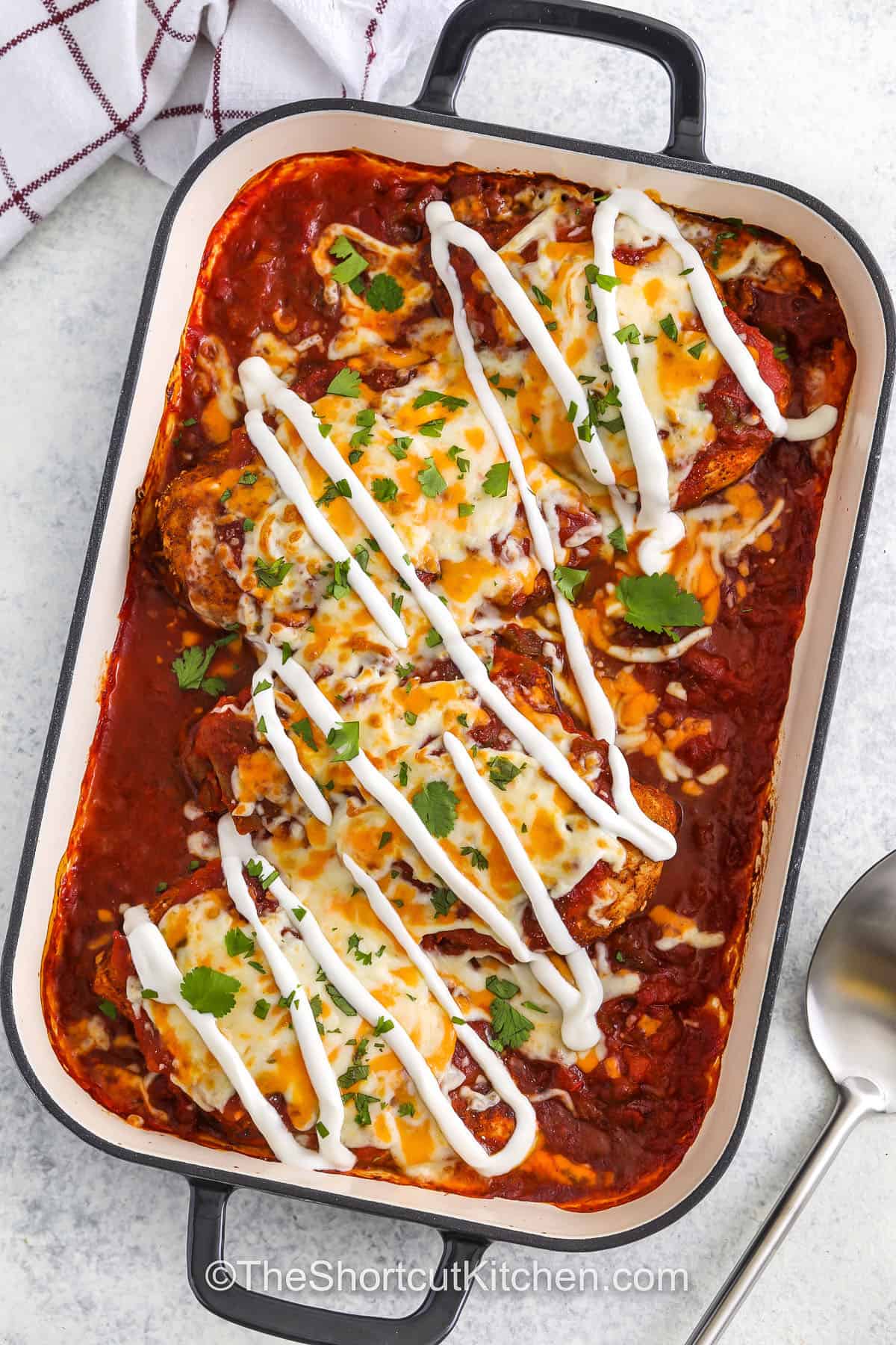 top view of cheesy Baked Salsa Chicken in a casserole dish