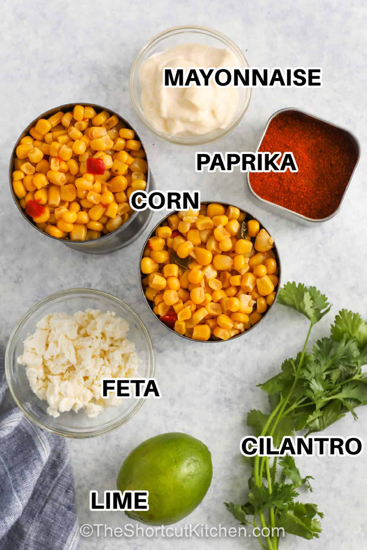 mayonnaise , paprika , corn , feta , cilantro , lime with labels to make Mexican Corn Salad With Canned Corn