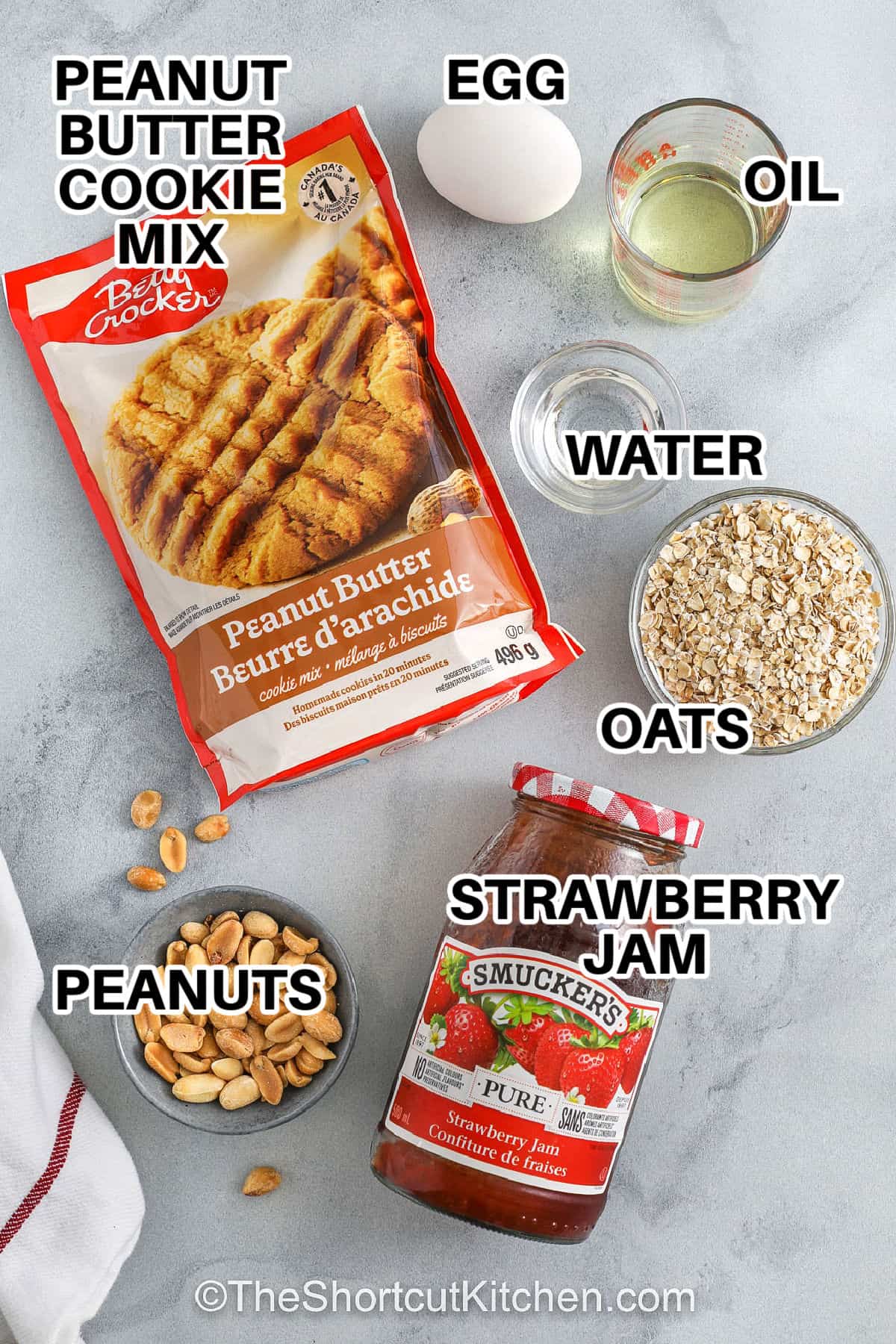 peanut butter cookie mix , egg , oil , water , oats , strawberry jam and peanuts with labels to make Peanut Butter and Jelly Bars