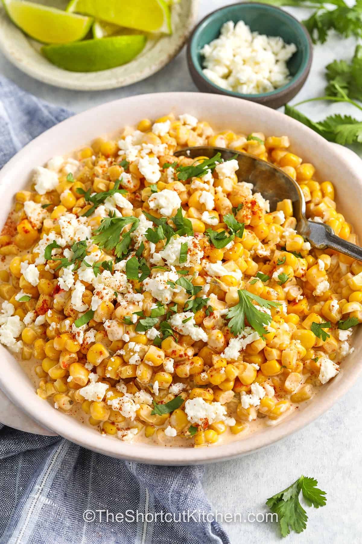 Mexican Corn Salad With Canned Corn in a bowl with a spoon