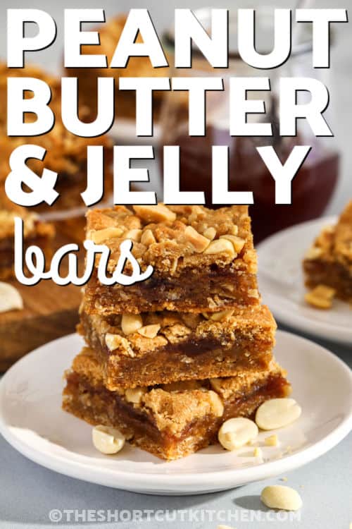 Peanut butter and jelly bars in a stack on a plate