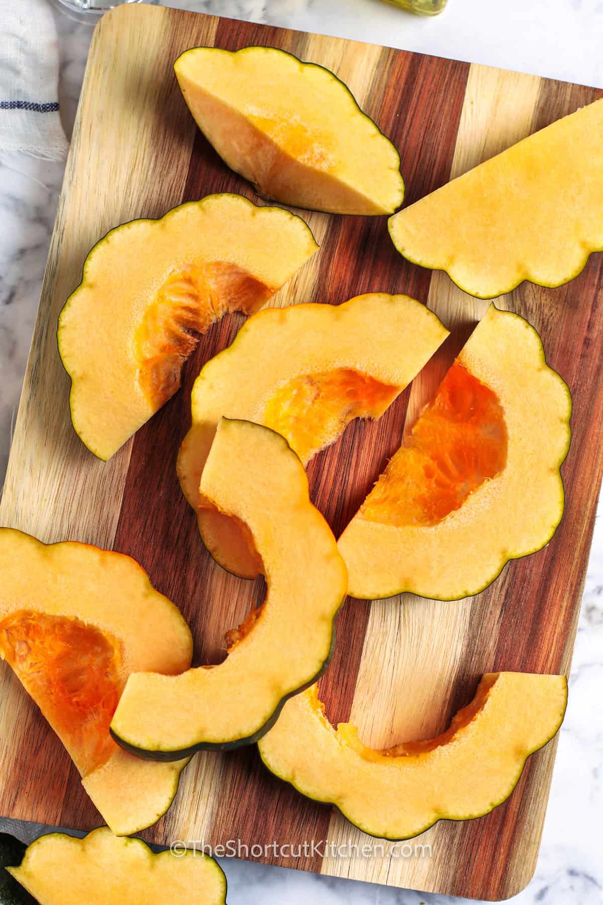 cut up squash to make Oven Roasted Acorn Squash