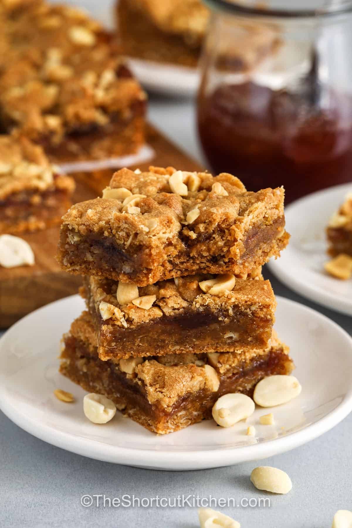 plated Peanut Butter and Jelly Bars with a bite taken out of one