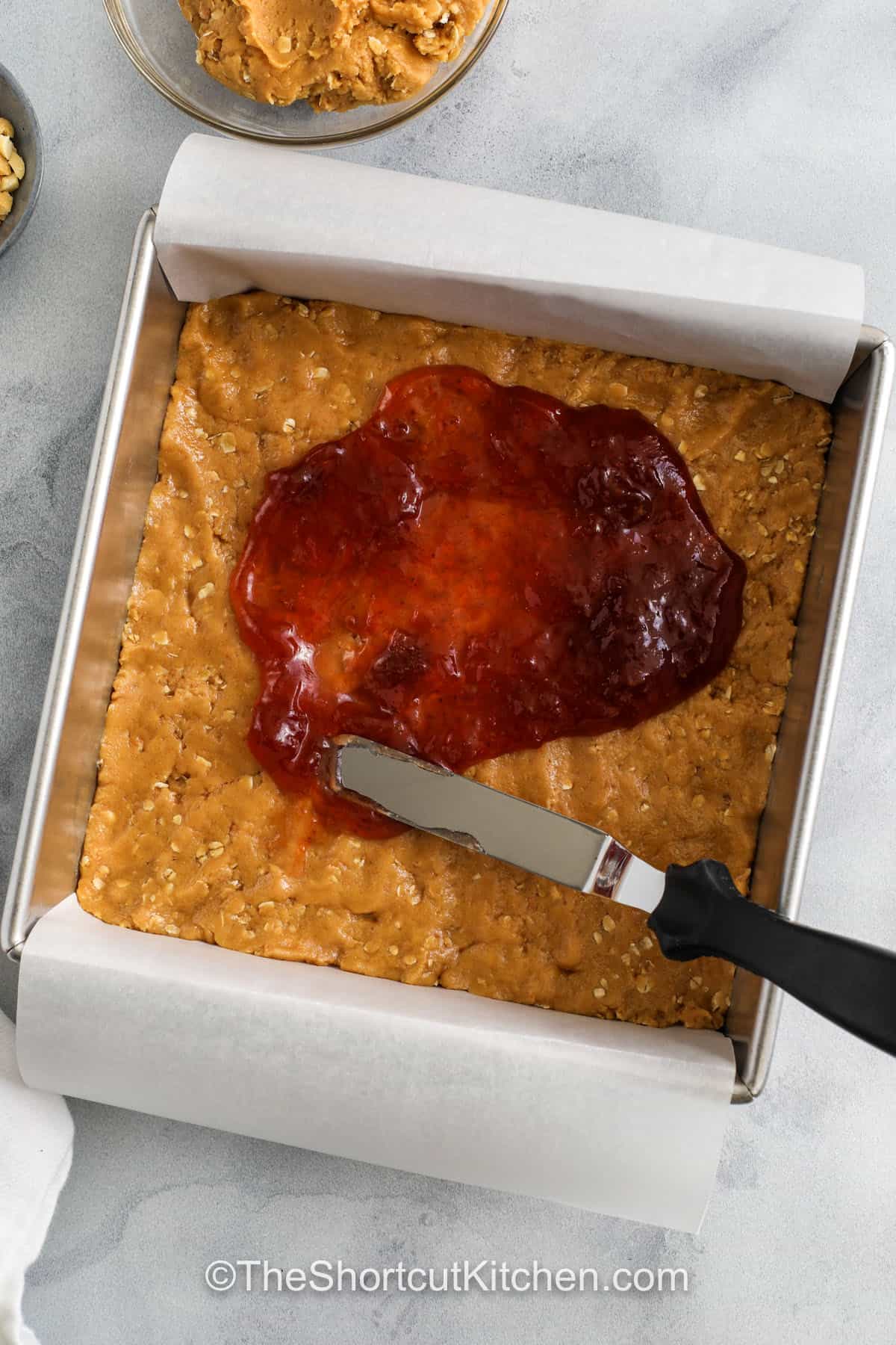 adding jelly layer to Peanut Butter and Jelly Bars