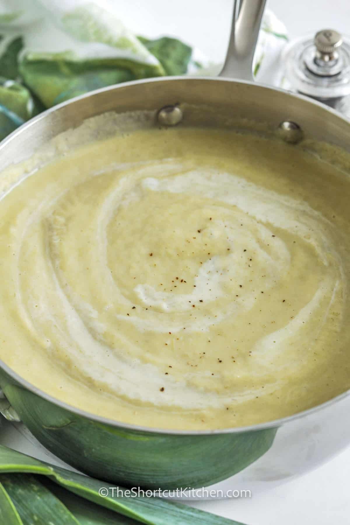 If you're looking for a wholesome and hearty dish, this cauliflower leek soup is a go-to favorite. Using just a few pantry staples, this recipe delivers big flavor with minimal effort. The blend of garlic, leeks, and cauliflower creates a deeply savory base that’s blended into creamy perfection. Enjoy it fresh or store it for easy meals later in the week. So simple and so good! #theshortcutkitchen creamy Cauliflower Leek Soup in a pot